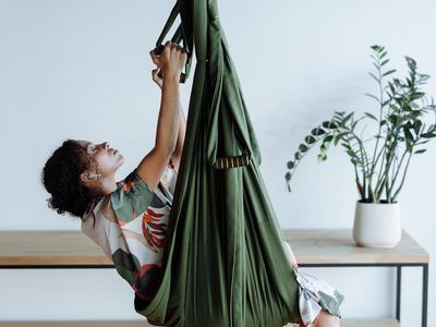 A quiet, empty yoga studio with mats rolled out, ready for practice.